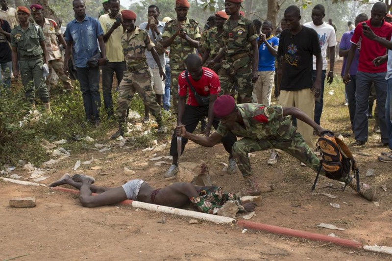 5 Siegfried Modola.February 05, 2014. A Central African Army soldier stabs the corpse of a man, who was killed as he was accused of joining the ousted Seleka fighters, in the capital Bangui, February 5, 2014.