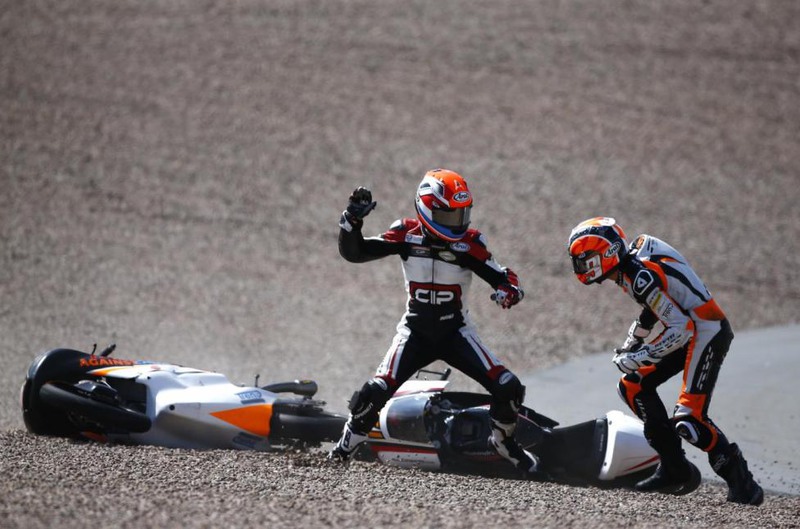 8 Thomas Peter. Mahindra Moto3 rider Bryan Schouten of the Netherlands fights with compatriot Kalex KTM Moto3 rider Scott Deroue (R) after they crashed during the German Grand Prix at the Sachsenring circuit in Hohenstein-Ernstthal, July 13, 2014.