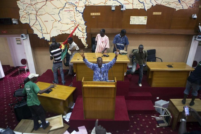 22 Joe Penney. Anti-government protesters take over the parliament building in Ouagadougou, capital of Burkina Faso, October 30, 2014.