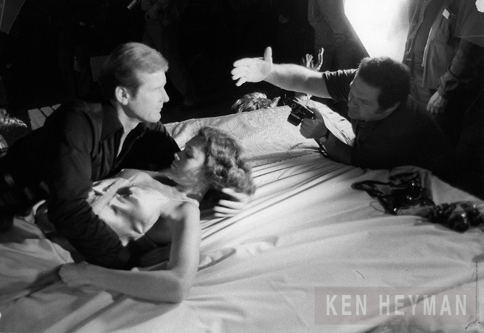 23 Ken Heyman directing Roger Moore on the set of...