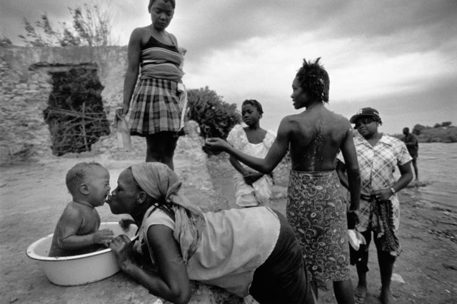 Haiti. Bord de Mer de Limonade. 2000. At the dawn on saint James' day, pilgrims arrive to Bord de Mer and between the prayers, songs and drums, they get into trance.