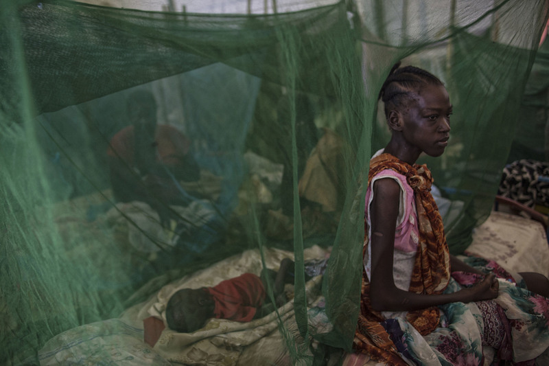 14 Civil war set off a vast food crisis. Among the malnourished were Bakhita Peter, 19, and her 5-month-old, Ajak Deng.
Lynsey Addario for The New York Times. MALAKAL, SOUTH SUDAN
05/11/2014