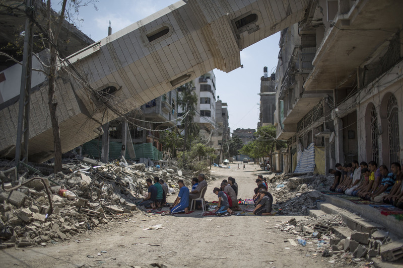 26 Palestinians prayed in the rubble of a mosque while a cease-fire with Israel was in effect.
Wissam Nassar for The New York Times. GAZA CITY
08/15/2014