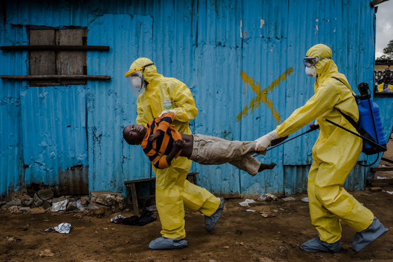 33 Medical workers took James Dorbor, 8, into an Ebola treatment center after he had spent hours waiting outside.
Daniel Berehulak for The New York Times. MONROVIA, LIBERIA
09/05/2014