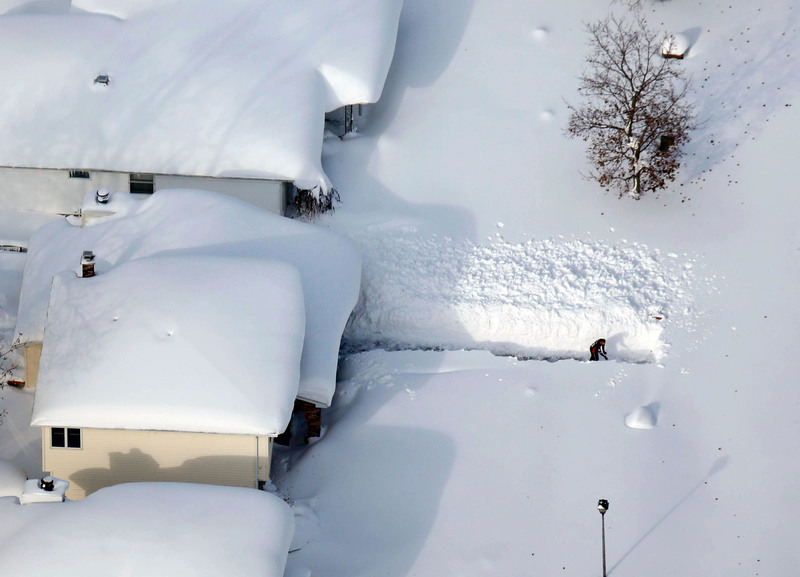 43 A man cleared his driveway after more than five feet of snow hit parts of the Buffalo area.
Derek Gee/The Buffalo News, via Associated Press. DEPEW, N.Y.
11/19/2014