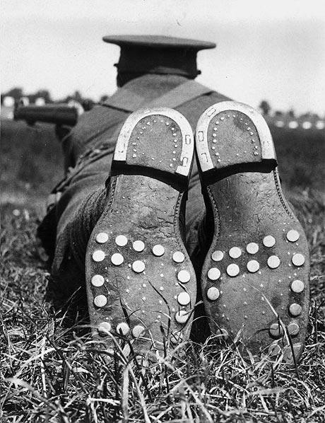 17. A soldier shooting in the Hopton Cup at Bisley shows his boots' steel studs, 1936.