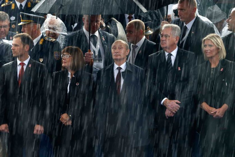 32  Автор - MARKO DJURICA—REUTERS. Russian President Vladimir Putin and Serbian President Tomislav Nikolic attend a military parade to mark 70 years since the city's liberation by the Red Army in Belgrade, Oct. 16, 2014.