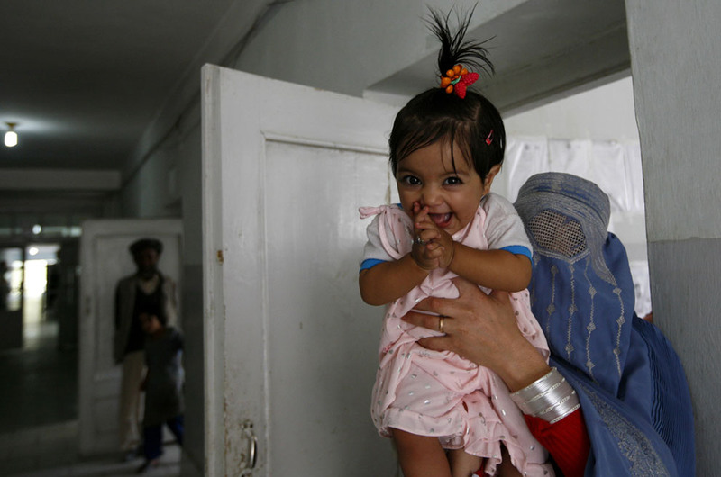 22 An Afghan girl reacts as she arrives with her mother for treatment in the local hospital of Feyzabad, on September 28, 2008. (AP Photo/Anja Niedringhaus)