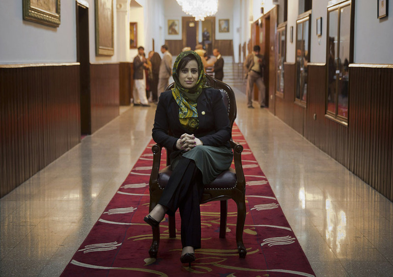28 Afghan lawmaker Hamida Ahmadzai, who represents Afghanistan's colorful Kuchi, poses for a picture inside the Afghan parliament in Kabul, on March 26, 2014. "In our Parliament we have 69 women, that is a large number, bigger even than European parliaments," Hamida said. (AP Photo/Anja Niedringhaus)