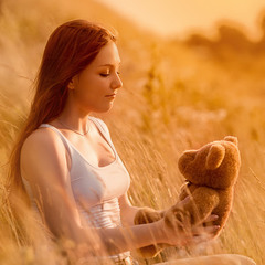 Portrait of a girl with a teddy bear