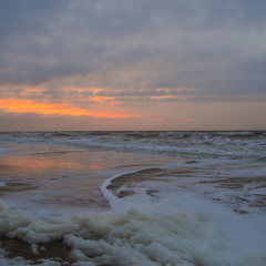 Sea foam at dawn