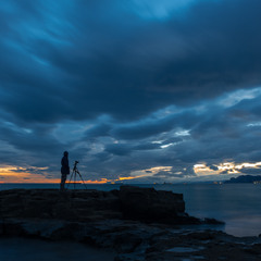 Фотограф снимающий закат.
