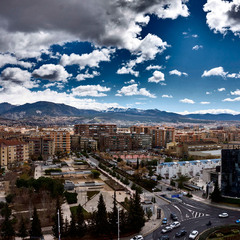 Clouds, mountains, buildings