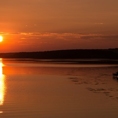 Lone fisherman at sunset