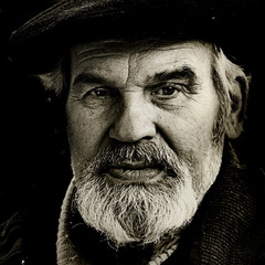 Portrait of a bearded man in a cap