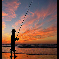 Young boy fisherman