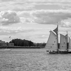 Fading Sails Beneath a Stone Torch and Sea Winds