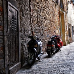 Vespas at the Gate. A Timeless Pause in Città Alta